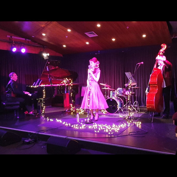 Stage performance with grand piano Curio Club Christchurch