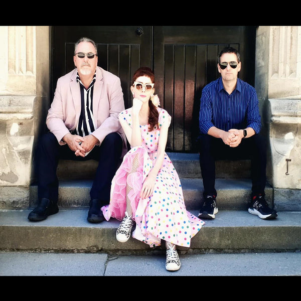 Curio Club Christchurch band sitting on steps colour image